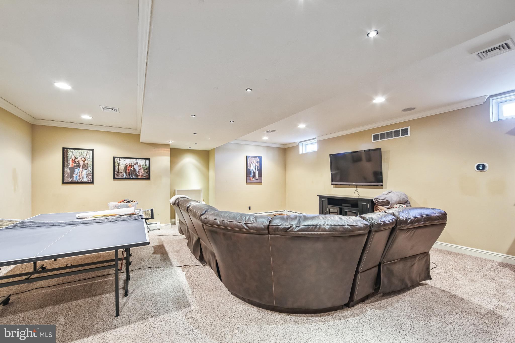 86 Sunset Road Royersford, PA 19468 - Photo 44 of 75 a living room with furniture and a flat screen tv