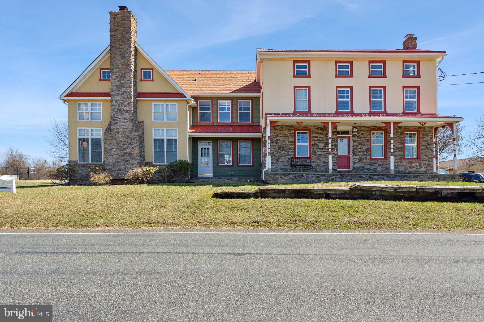 86 Sunset Road Royersford, PA 19468 - Photo 5 of 75 a front view of a house with a garden and lake view