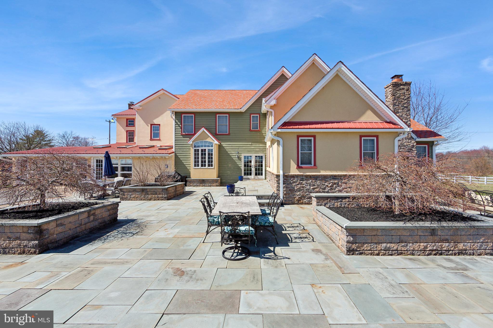 86 Sunset Road Royersford, PA 19468 - Photo 10 of 75 a view of a house with couches chairs and a fire pit