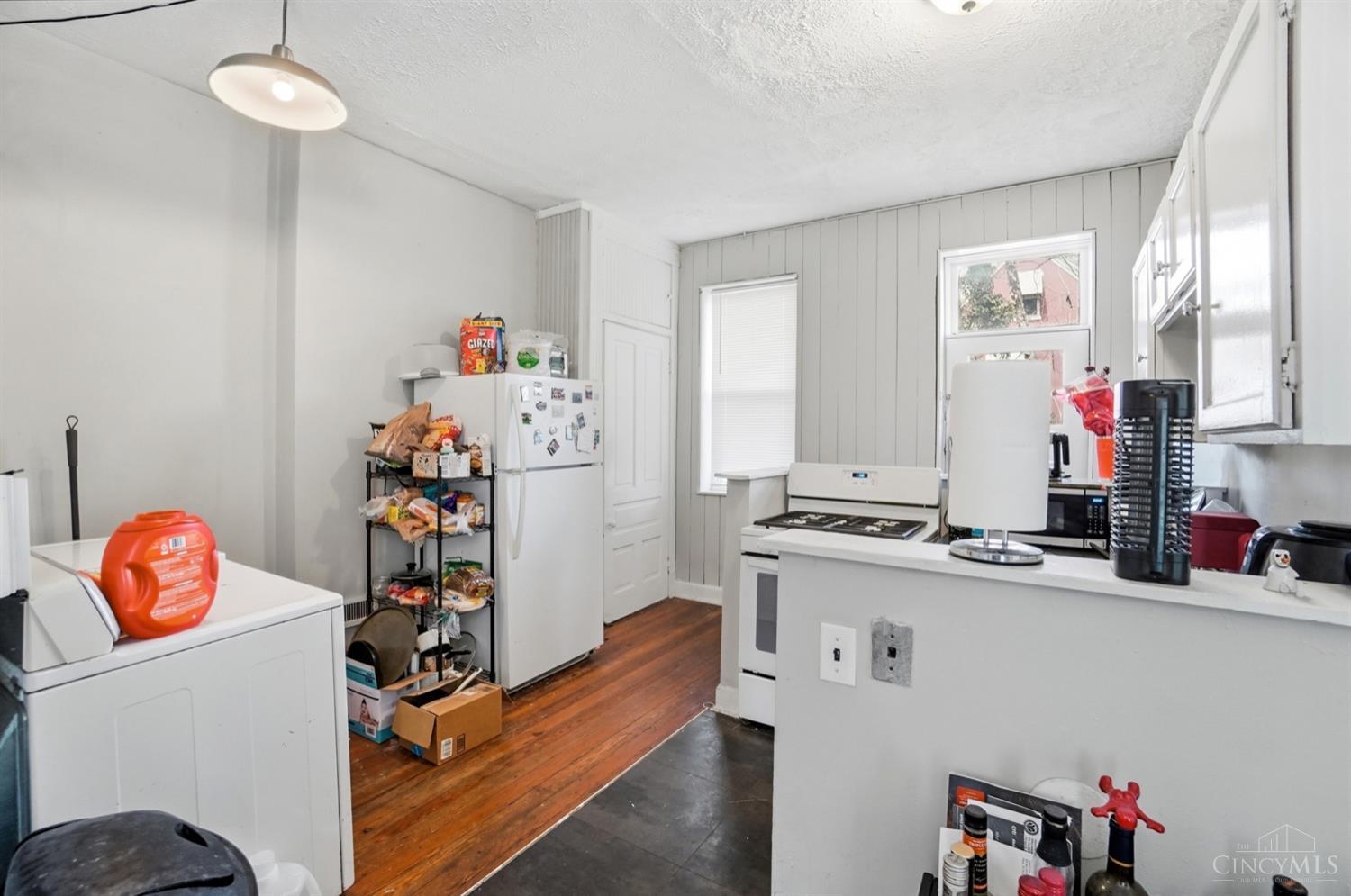 46 Graham Street Cincinnati, OH 45219 - Photo 4 of 22 Second floor kitchen with ample space and large pantry and direct access to back deck.
