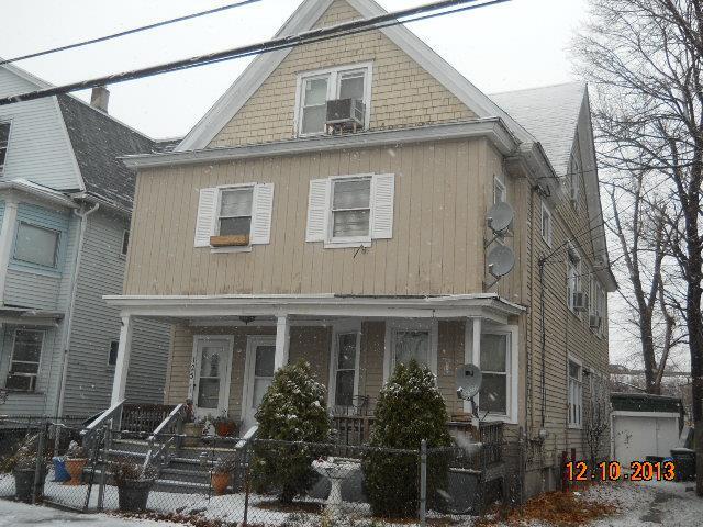 125 Smith Street Bridgeport, CT 06607 - Photo 1 of 1 a front view of a house with yard