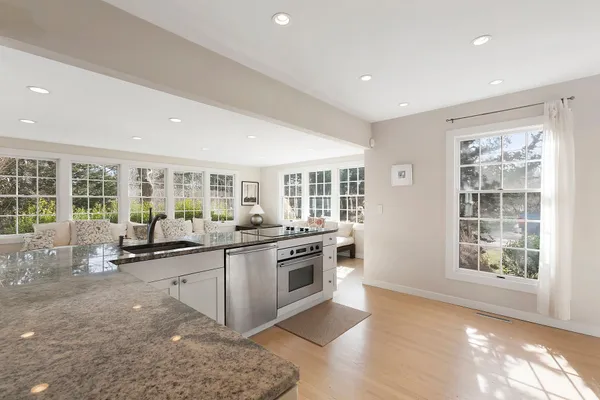 a kitchen with a refrigerator and a stove