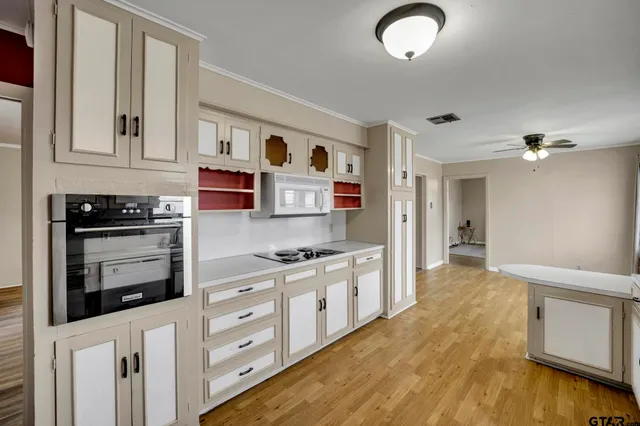 a kitchen with stainless steel appliances granite countertop a stove and a refrigerator
