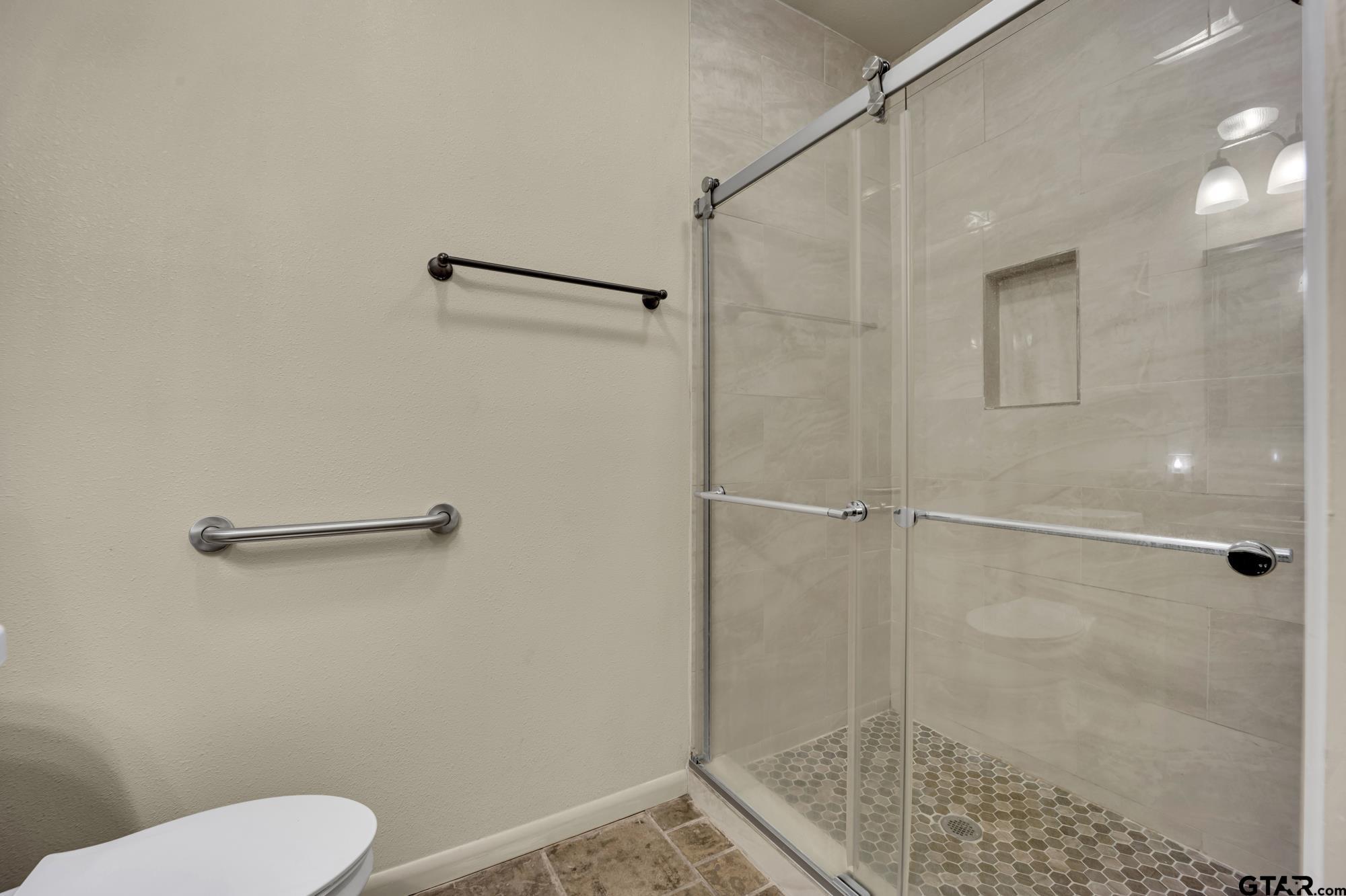 3204 West Tulsa Street Tyler, TX 75702 - Photo 16 of 24 a bathroom with a shower