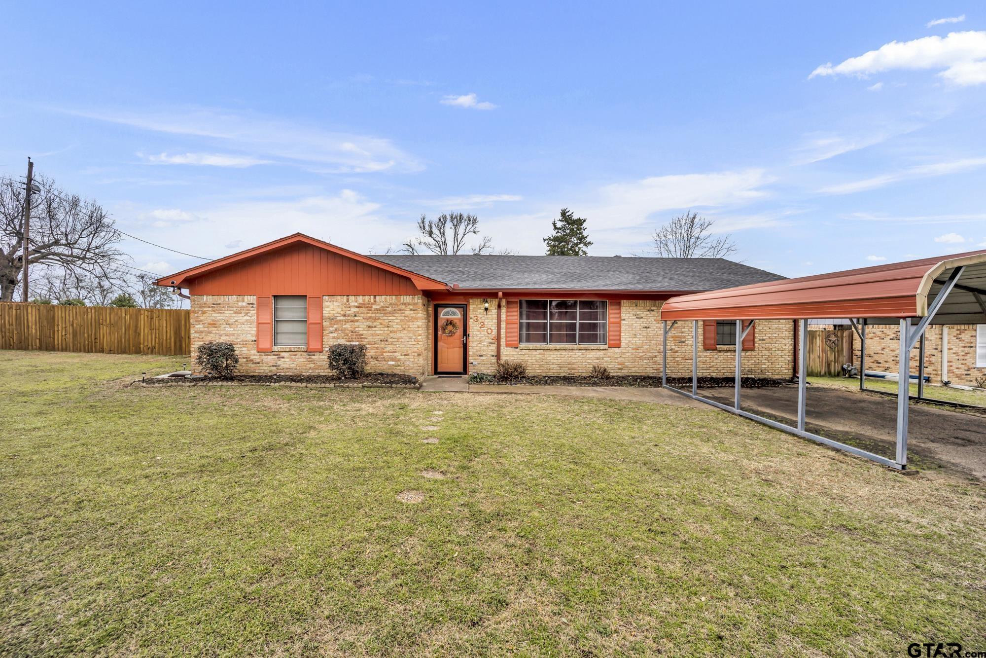 3204 West Tulsa Street Tyler, TX 75702 - Photo 2 of 24 a front view of a house with a yard