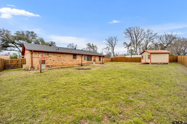 a view of a swimming pool with an outdoor space and seating area