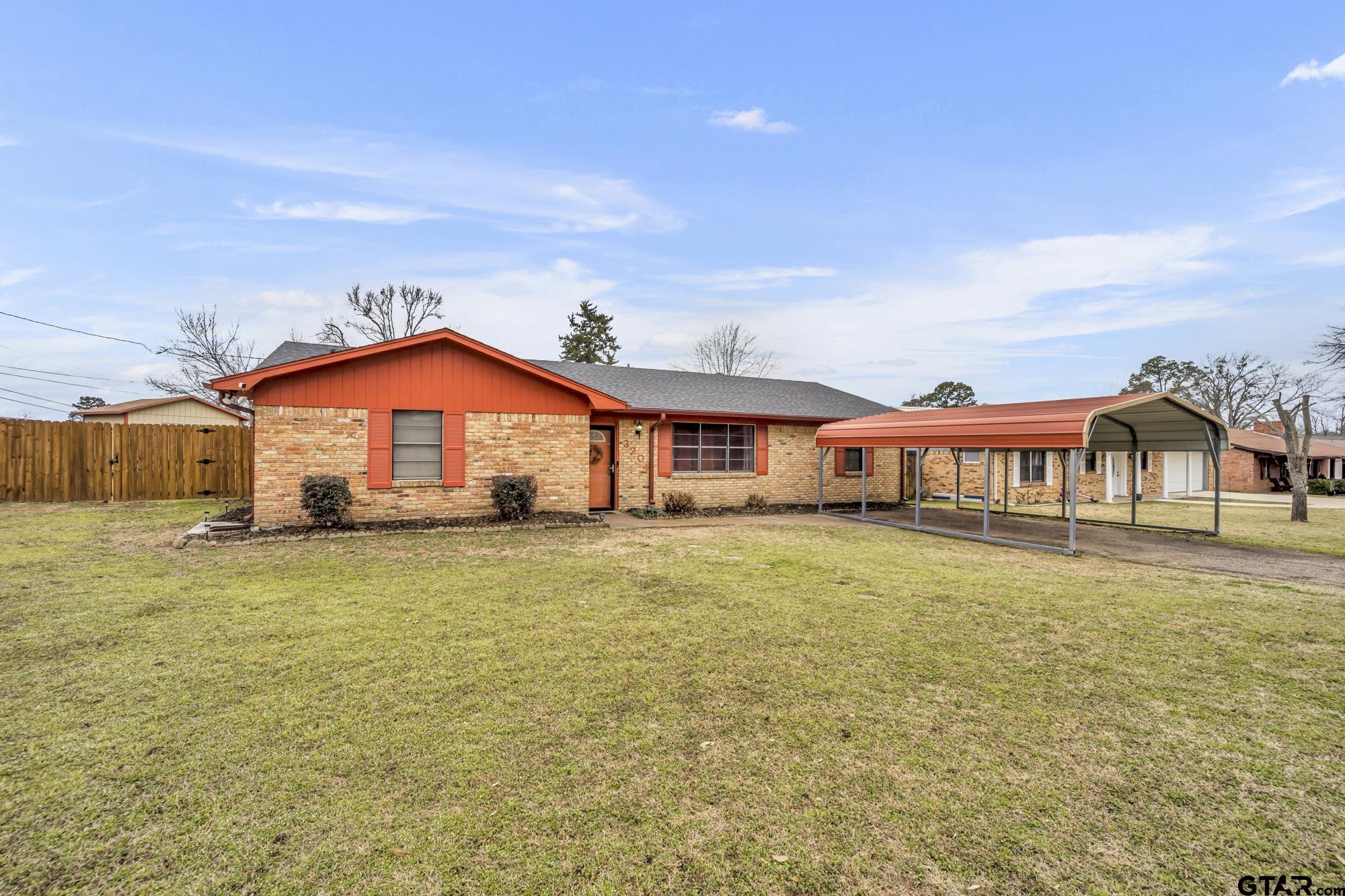 3204 West Tulsa Street Tyler, TX 75702 - Photo 3 of 24 a front view of a house with a yard