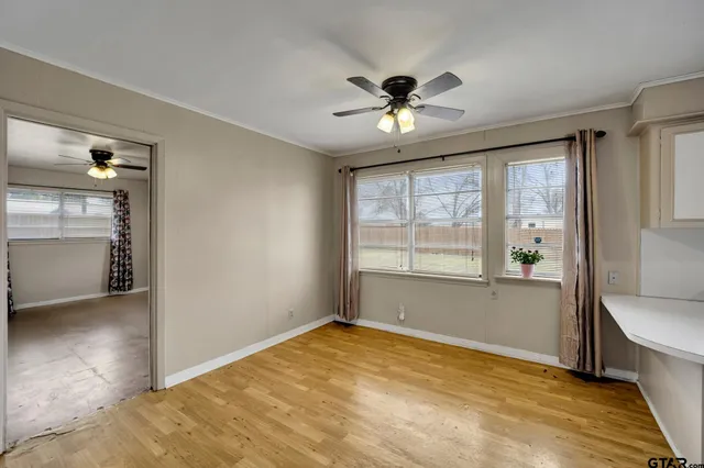 a view of an empty room with a window