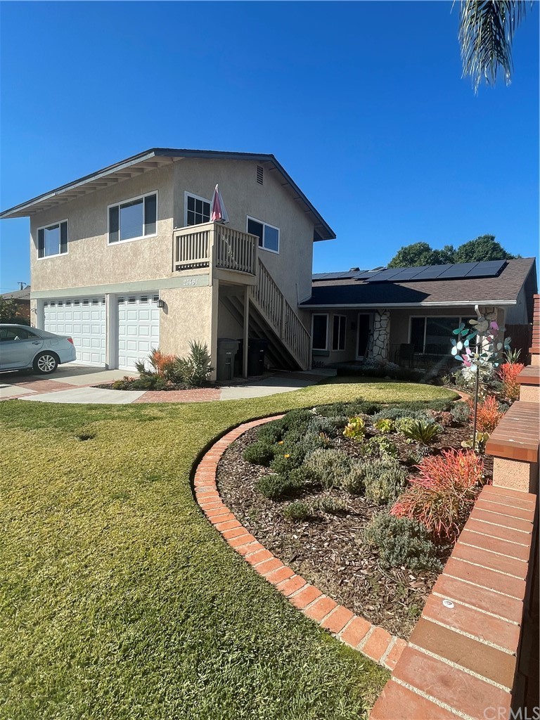 23461 Cavanaugh Road Lake Forest, CA 92630 - Photo 1 of 1 a front view of a house with garden