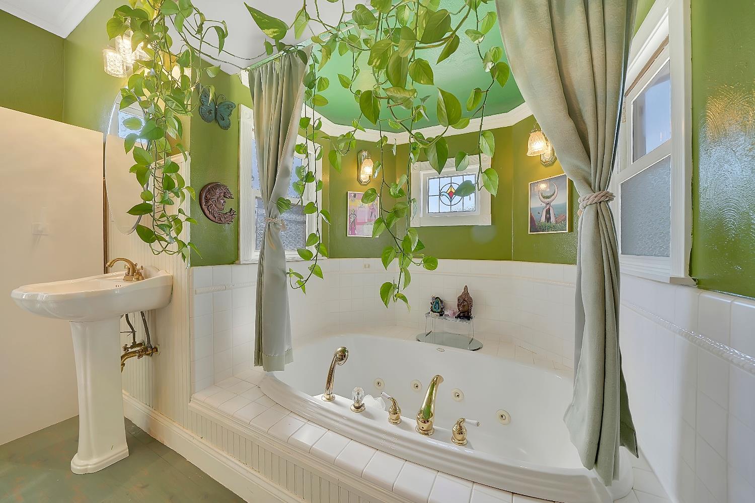 104 South Church Street Ione, CA 95640 - Photo 20 of 33 Spacious Spa bathroom with relaxing sunken tub, stained glass windows