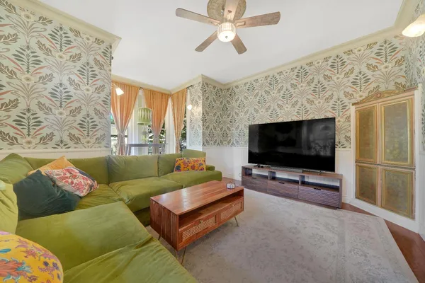 a living room with furniture and a flat screen tv
