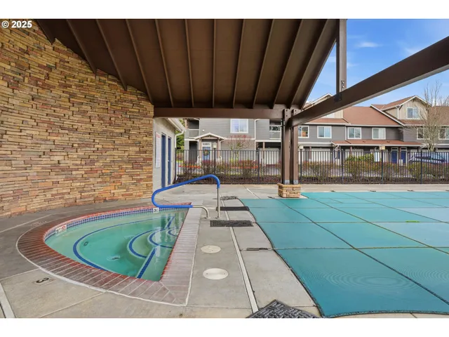 a picture of water heater room with wooden floor