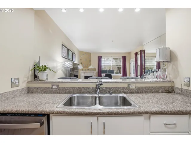 a kitchen with granite countertop a sink and a granite top