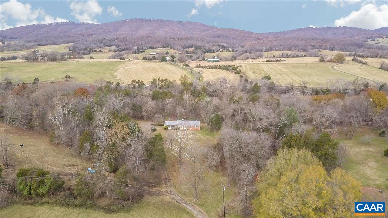 3384 Keswick Road Keswick, VA 22947 - Photo 31 of 49 a view of a lake with mountains in the background