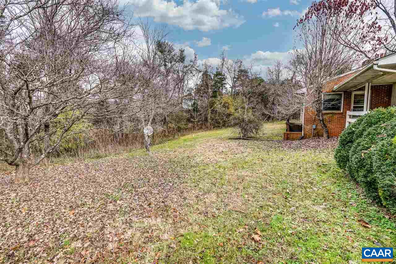 3384 Keswick Road Keswick, VA 22947 - Photo 40 of 49 a backyard of a house with lots of green space