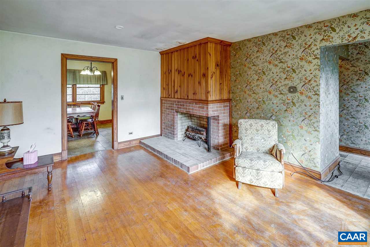 3384 Keswick Road Keswick, VA 22947 - Photo 8 of 49 a living room with furniture and a fireplace