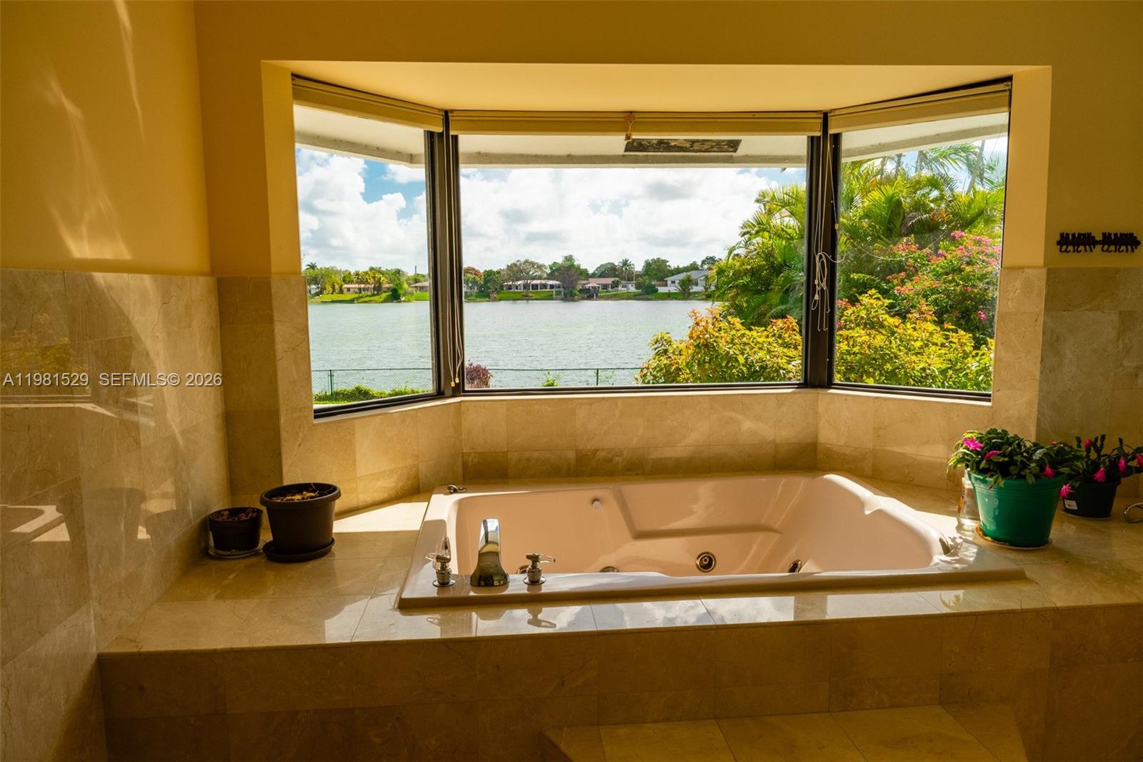4655 Southwest 89th Avenue Miami, FL 33165 - Photo 12 of 38 a bath tub sitting next to a window
