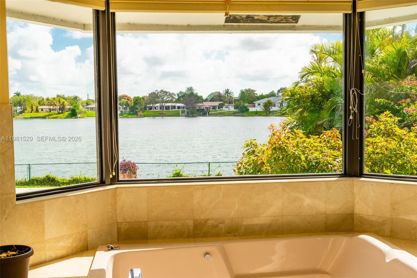 4655 Southwest 89th Avenue Miami, FL 33165 - Photo 13 of 38 a view of a lake from a window