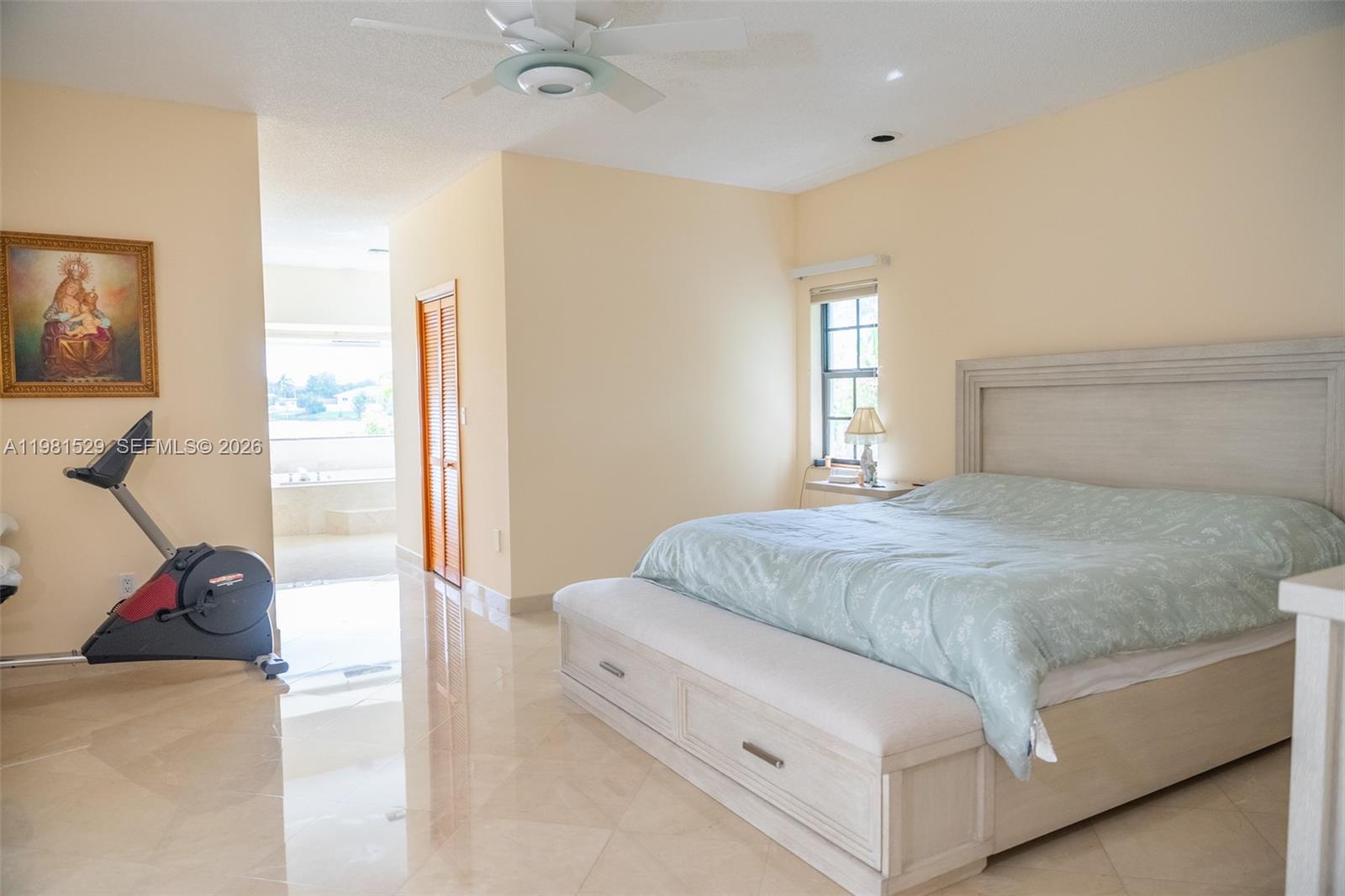 4655 Southwest 89th Avenue Miami, FL 33165 - Photo 17 of 38 a spacious bedroom with a bed and a dresser