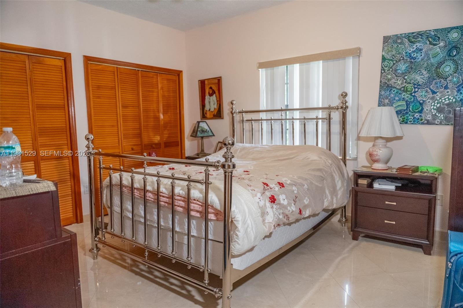 4655 Southwest 89th Avenue Miami, FL 33165 - Photo 19 of 38 a bedroom with a bed and a window