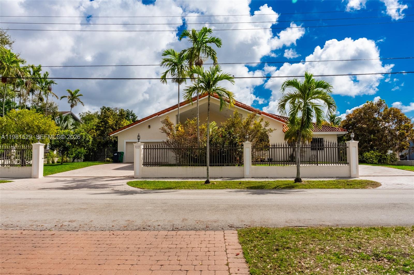 4655 Southwest 89th Avenue Miami, FL 33165 - Photo 2 of 38 a view of street with houses