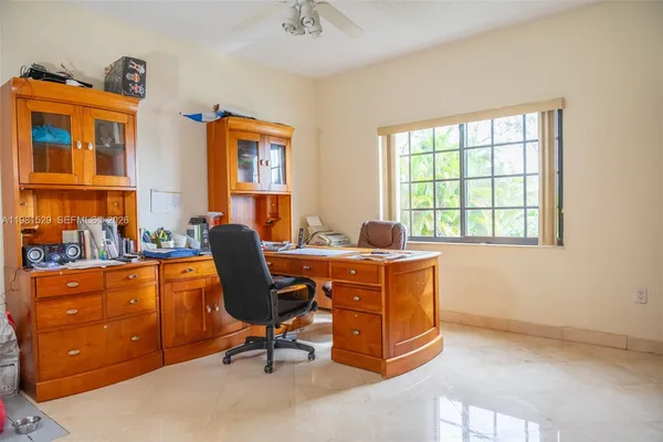 a workspace with furniture and a window