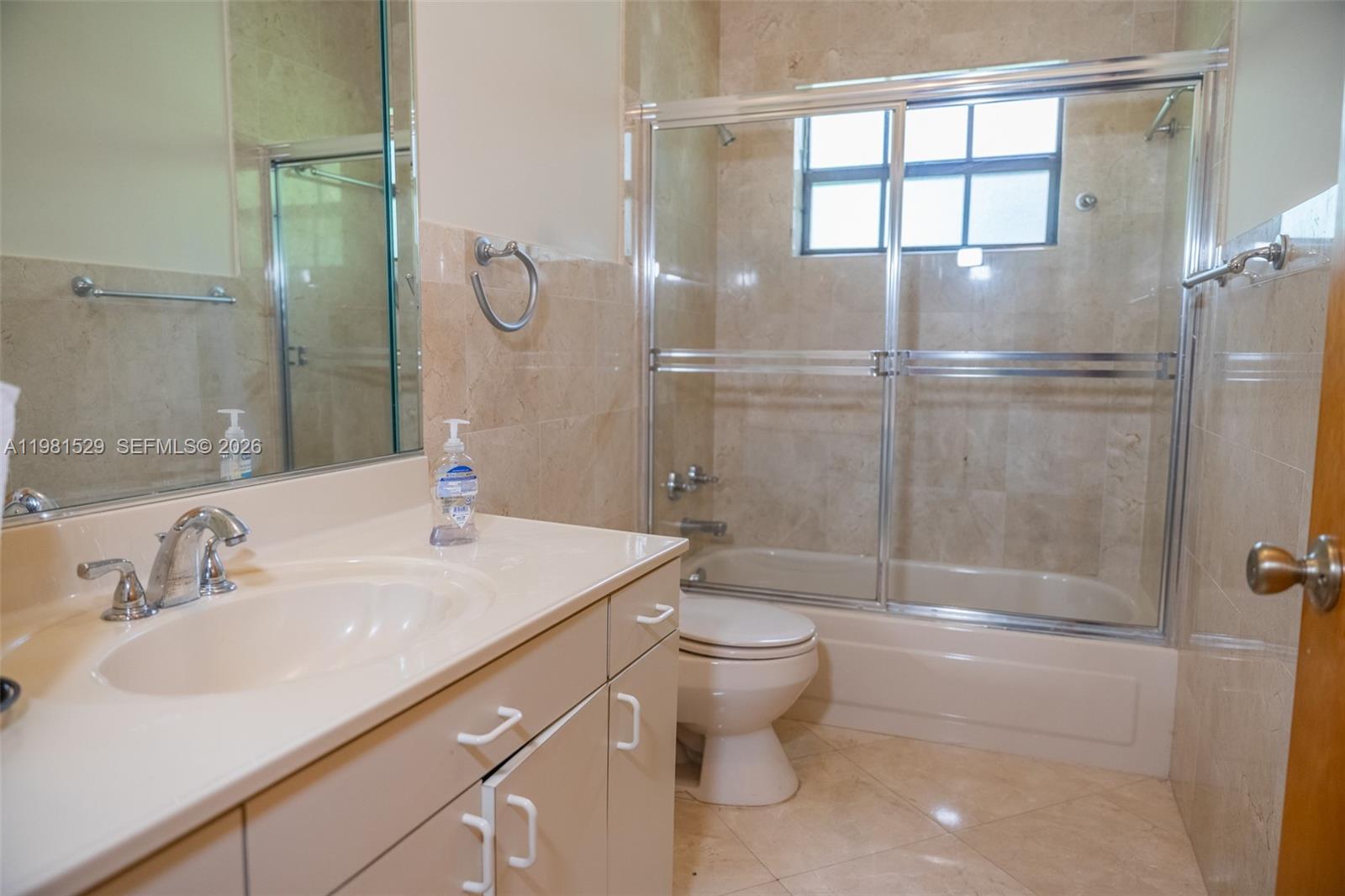 4655 Southwest 89th Avenue Miami, FL 33165 - Photo 23 of 38 a bathroom with a sink a toilet and shower