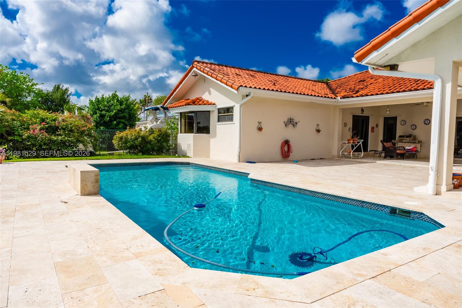 4655 Southwest 89th Avenue Miami, FL 33165 - Photo 26 of 38 a view of a white house with a yard