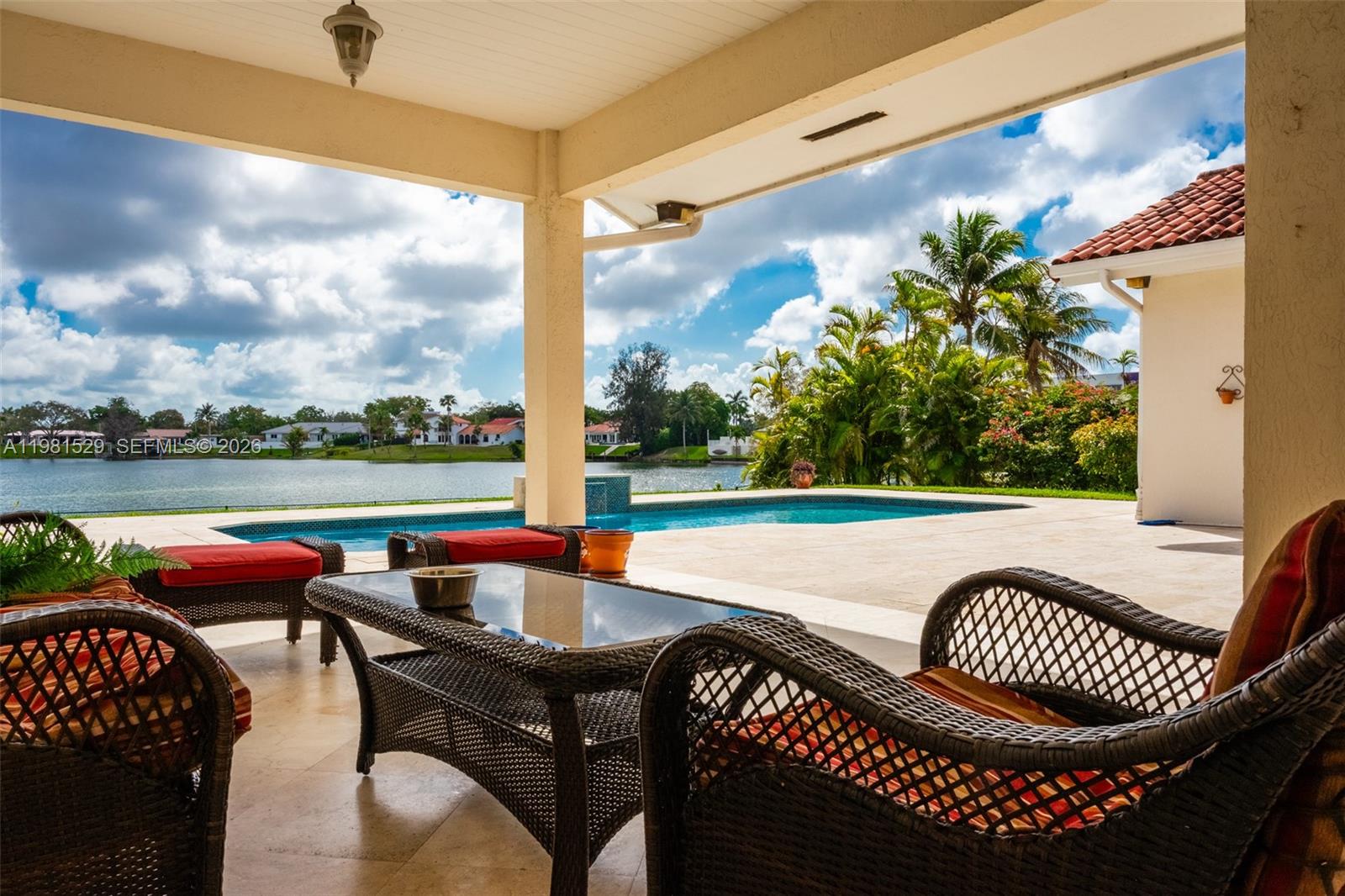 4655 Southwest 89th Avenue Miami, FL 33165 - Photo 29 of 38 a view of a patio with couches chairs and a table