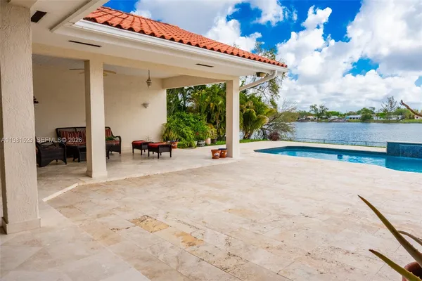 a view of a patio with a table and chairs