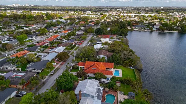 an aerial view of residential houses with outdoor space