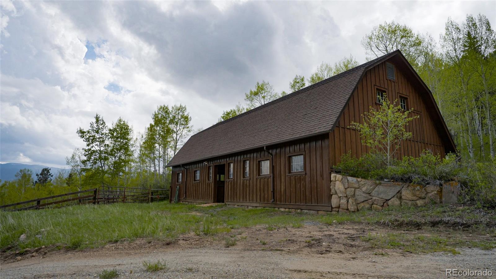 950 Corral Creek Road Evergreen, CO 80439 - Photo 11 of 50 a backyard of a house with plants and trees