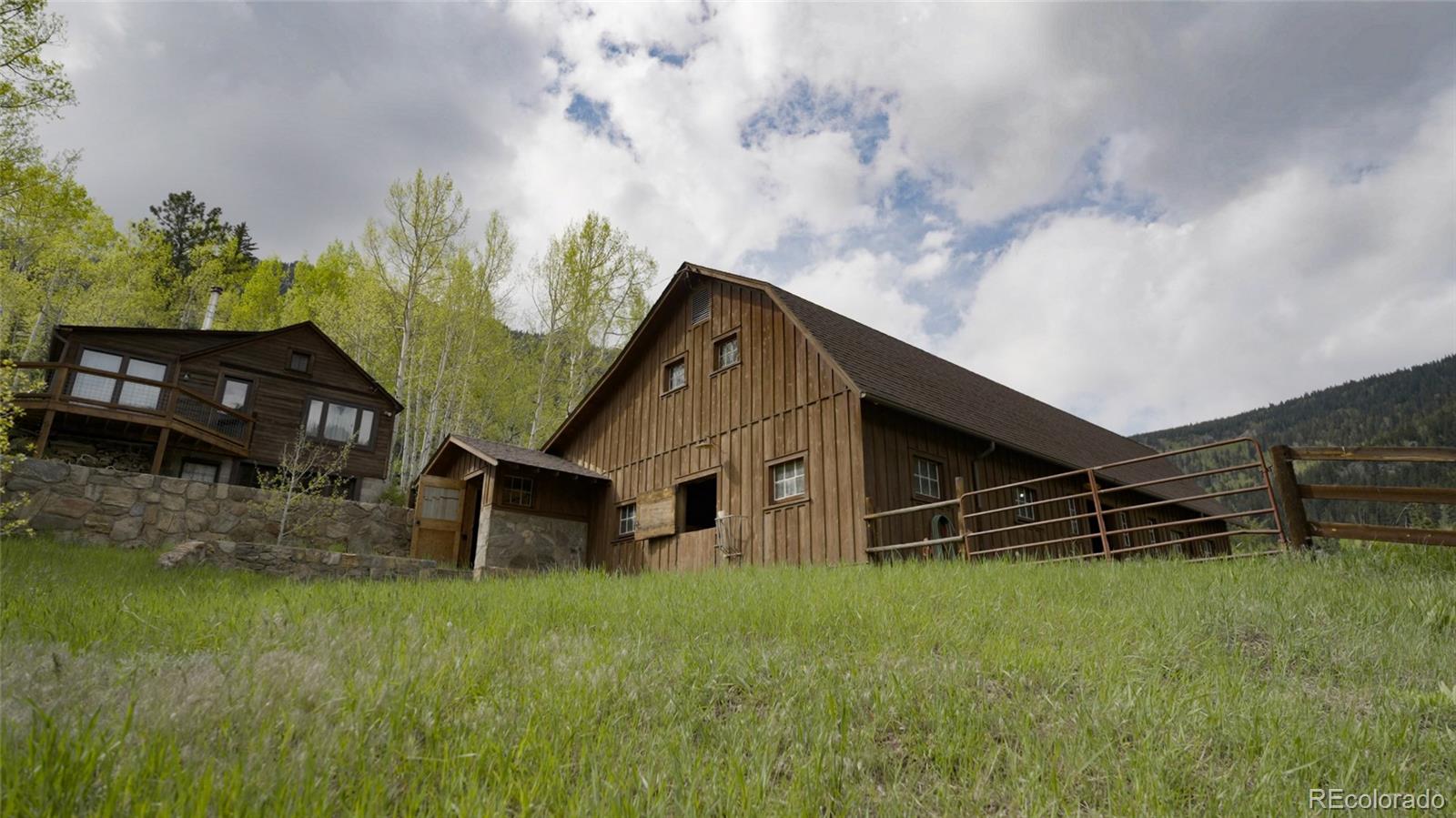 950 Corral Creek Road Evergreen, CO 80439 - Photo 14 of 50 a house view with a garden space