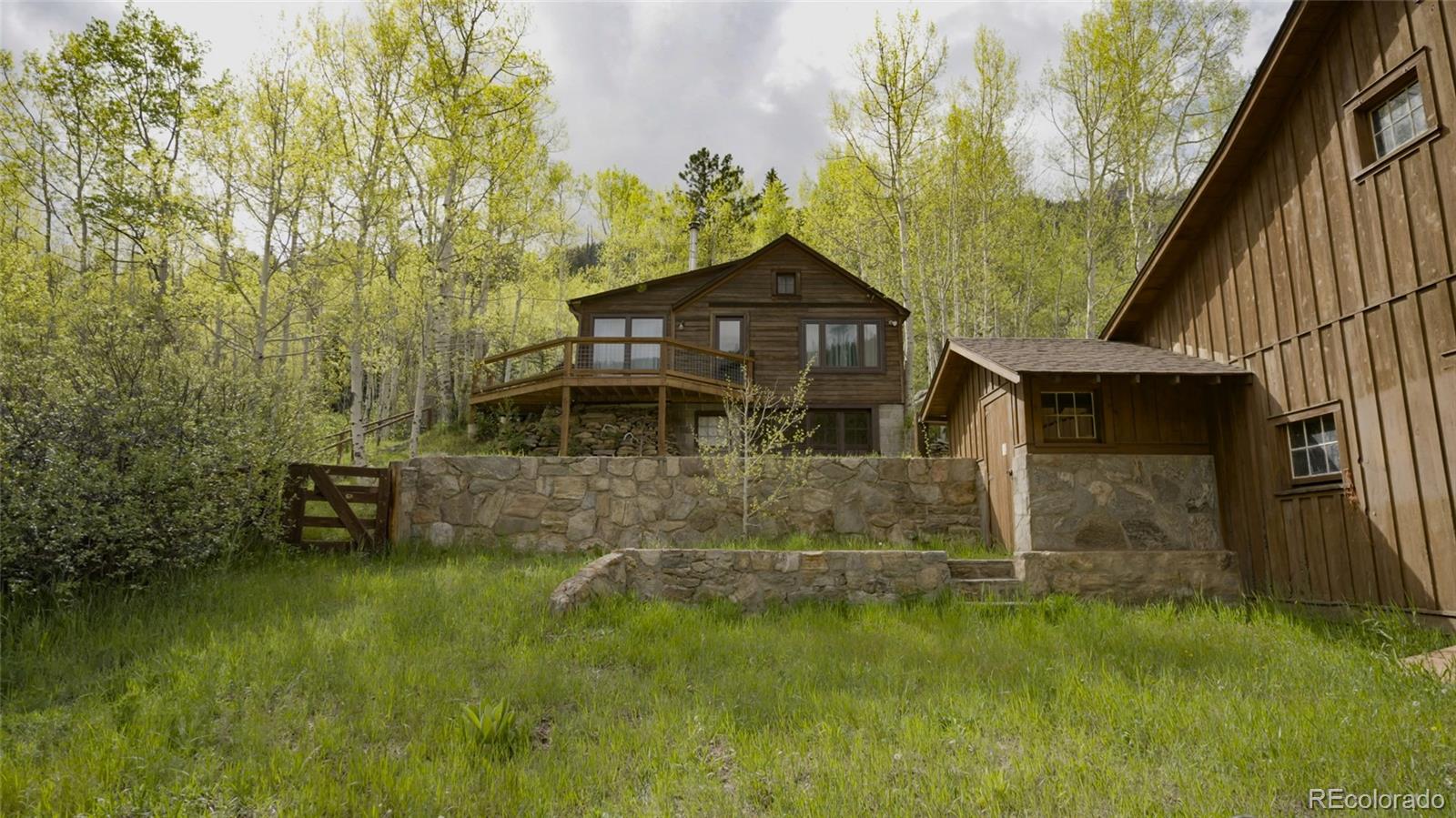 950 Corral Creek Road Evergreen, CO 80439 - Photo 16 of 50 a view of a pathway of a house with a yard