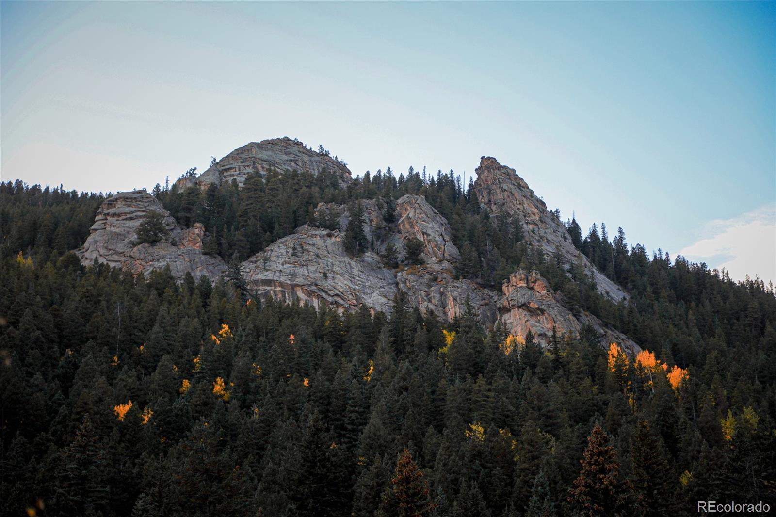 950 Corral Creek Road Evergreen, CO 80439 - Photo 32 of 50 a view of a house in a field