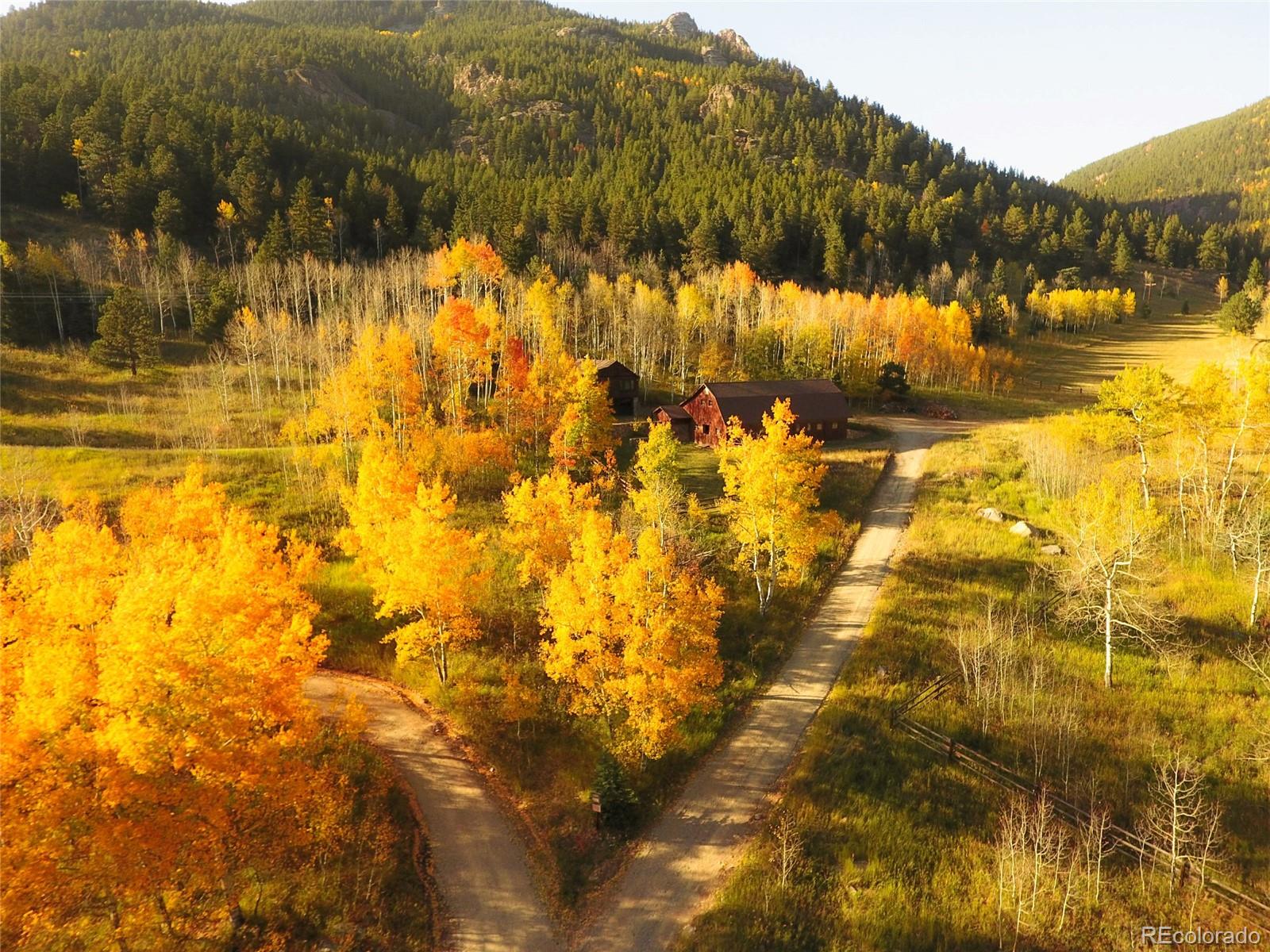 950 Corral Creek Road Evergreen, CO 80439 - Photo 43 of 50 a view of swimming pool of water with mountain view