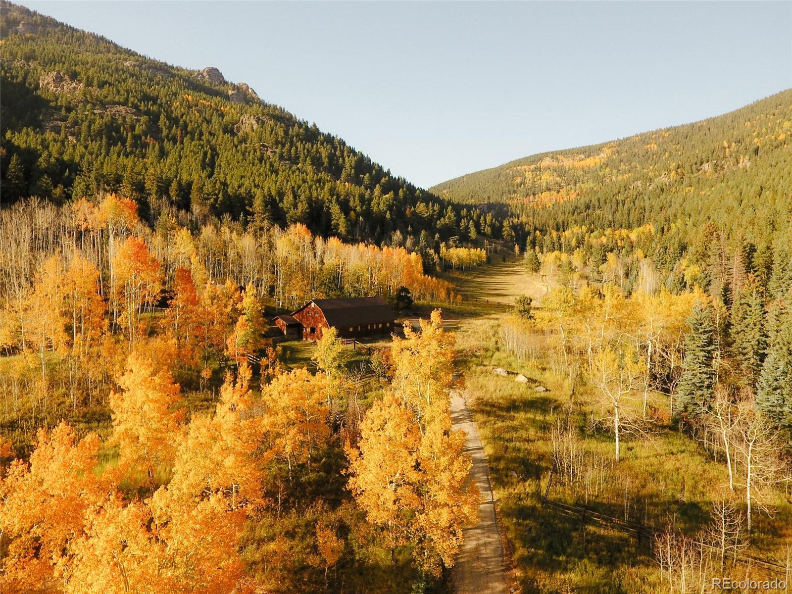 950 Corral Creek Road Evergreen, CO 80439 - Photo 45 of 50 a view of swimming pool and mountain