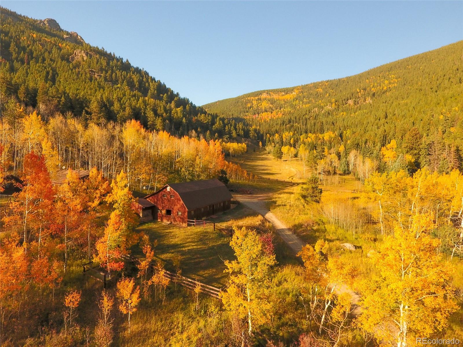 950 Corral Creek Road Evergreen, CO 80439 - Photo 46 of 50 a view of outdoor space and swimming pool