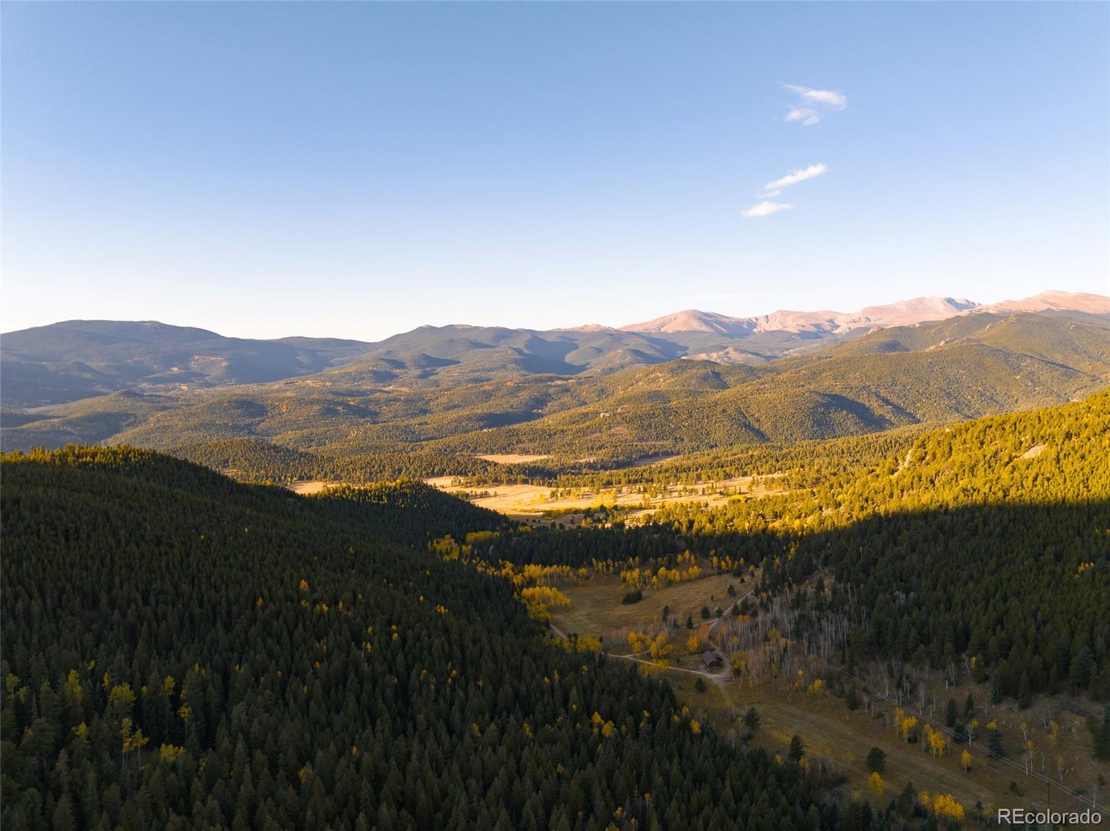 950 Corral Creek Road Evergreen, CO 80439 - Photo 49 of 50 a view of an ocean and a mountain