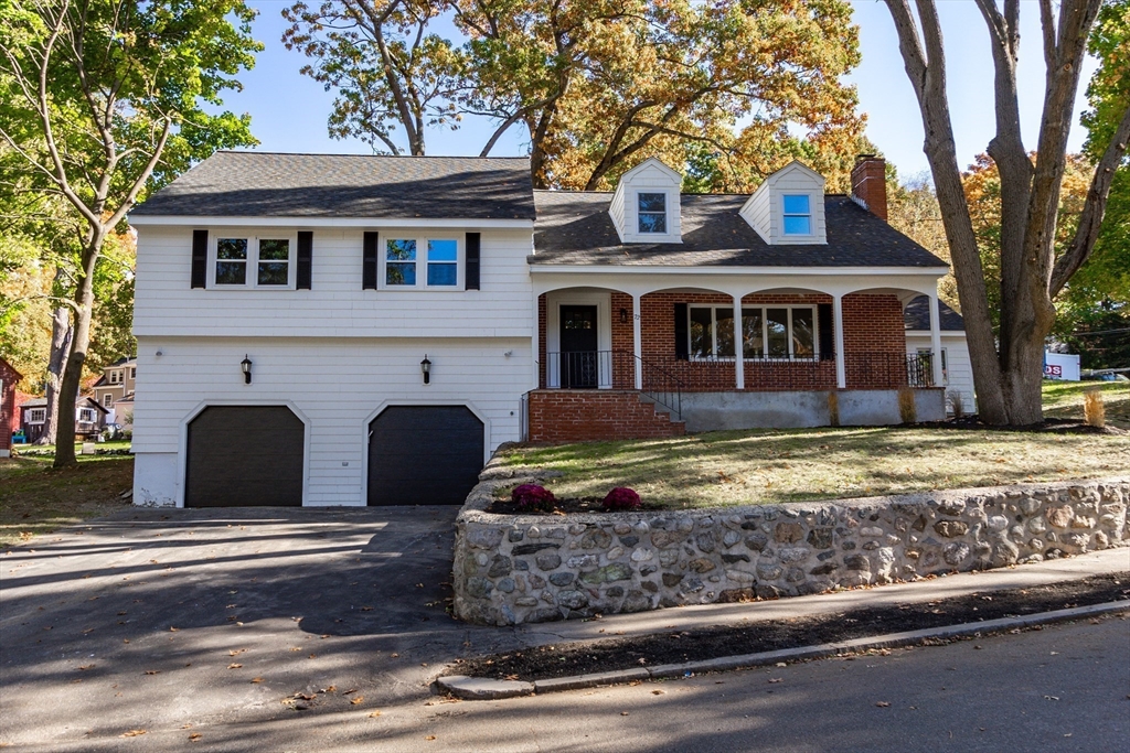 72 Outlook Road Wakefield, MA 01880 - Photo 1 of 42 a front view of a house with garden