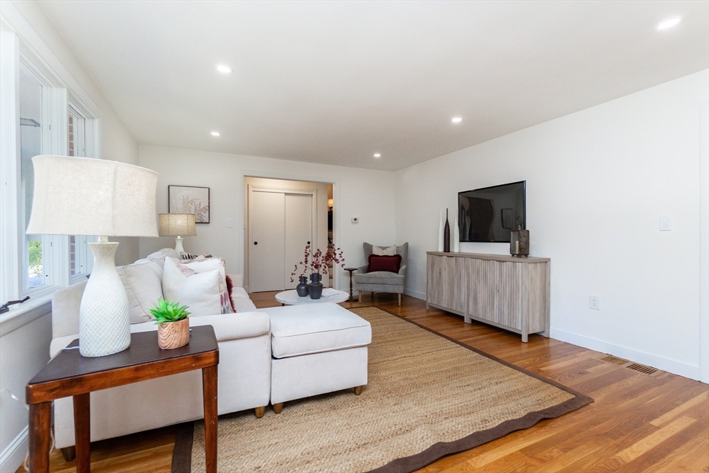 72 Outlook Road Wakefield, MA 01880 - Photo 11 of 42 a living room with furniture and a flat screen tv