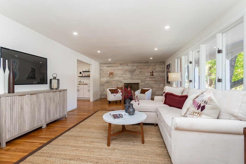 72 Outlook Road Wakefield, MA 01880 - Photo 13 of 42 a living room with furniture a rug and a flat screen tv