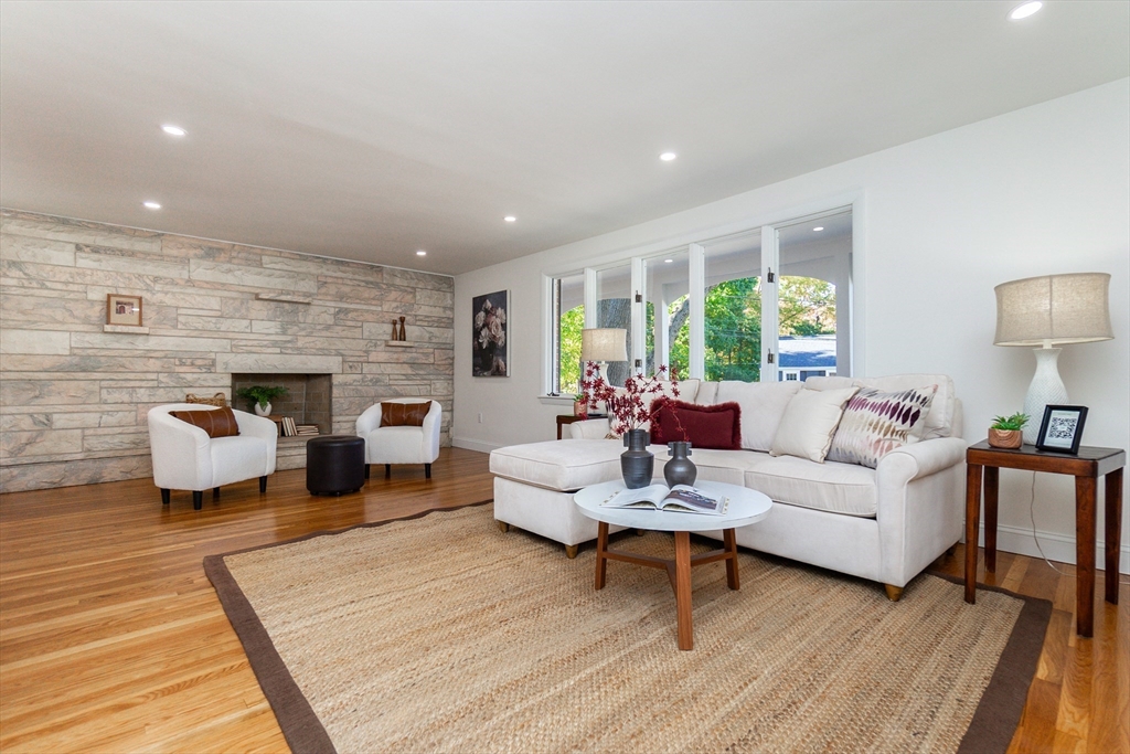 72 Outlook Road Wakefield, MA 01880 - Photo 14 of 42 a living room with furniture fireplace and a table