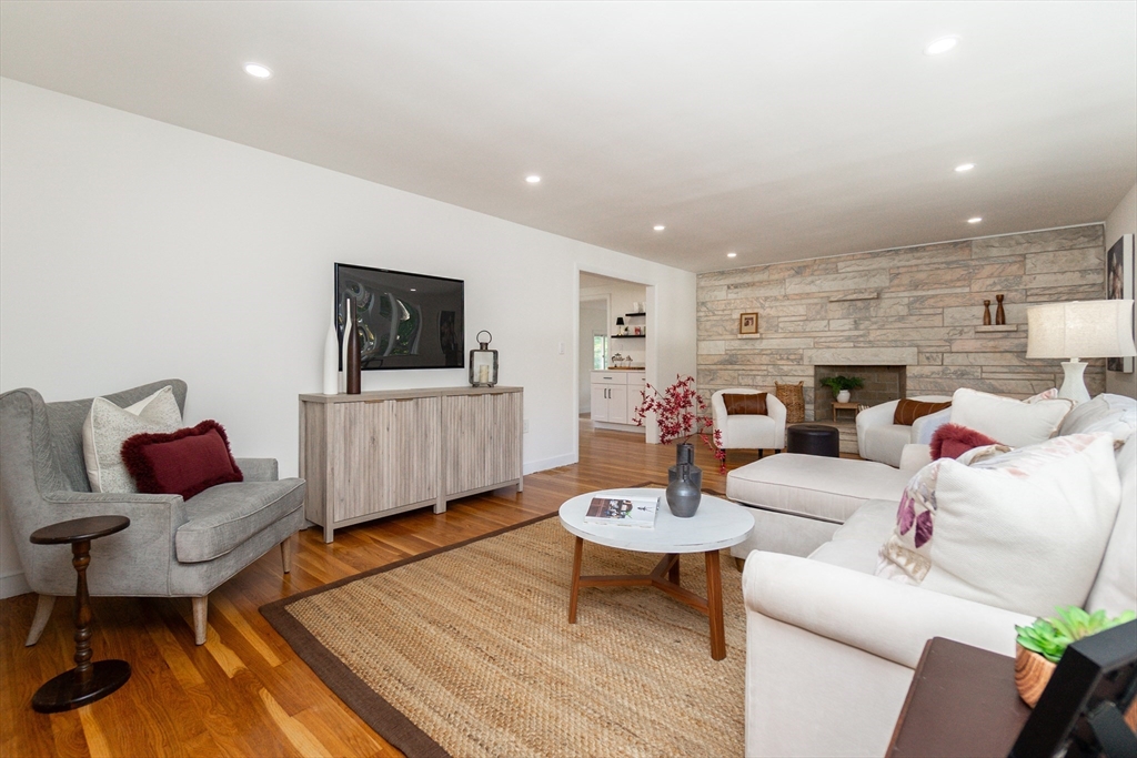 72 Outlook Road Wakefield, MA 01880 - Photo 16 of 42 a living room with furniture and a flat screen tv
