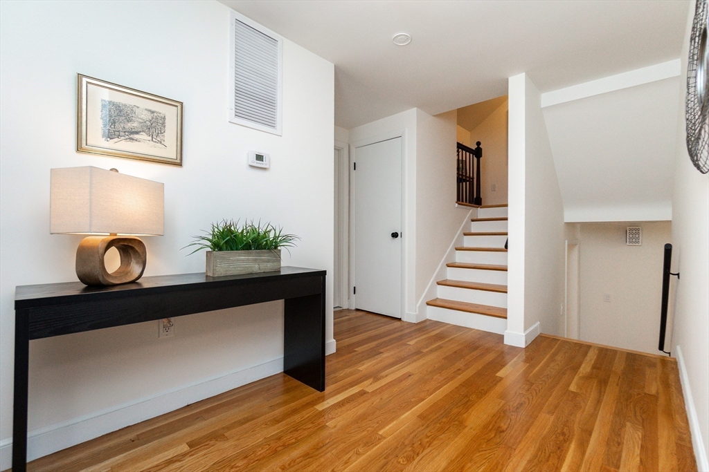 72 Outlook Road Wakefield, MA 01880 - Photo 21 of 42 a view of a hallway with wooden floor and staircase