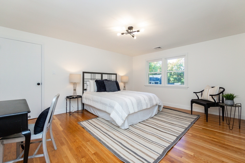 72 Outlook Road Wakefield, MA 01880 - Photo 22 of 42 a bedroom with a bed a table and chair