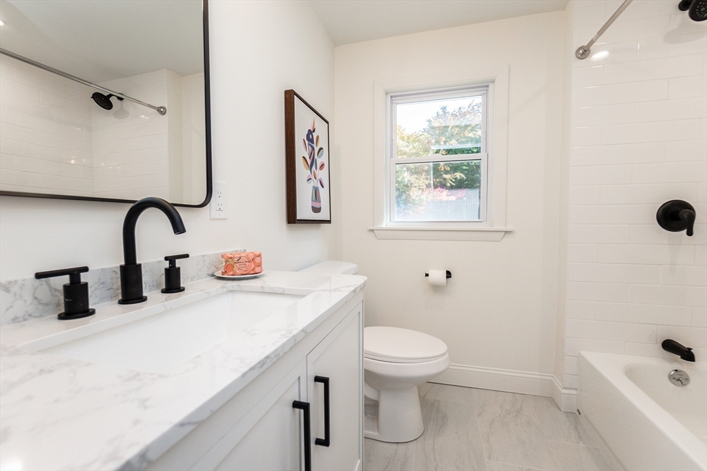 72 Outlook Road Wakefield, MA 01880 - Photo 24 of 42 a bathroom with a sink toilet and shower