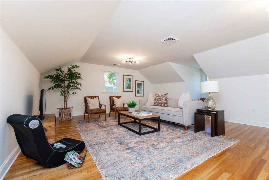 72 Outlook Road Wakefield, MA 01880 - Photo 32 of 42 a living room with furniture and a couch