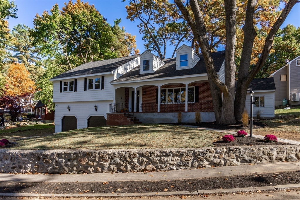 72 Outlook Road Wakefield, MA 01880 - Photo 36 of 42 a view of a house with a tree in front of it