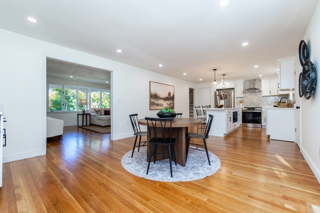 72 Outlook Road Wakefield, MA 01880 - Photo 6 of 42 a living room with furniture and a dining table with wooden floor